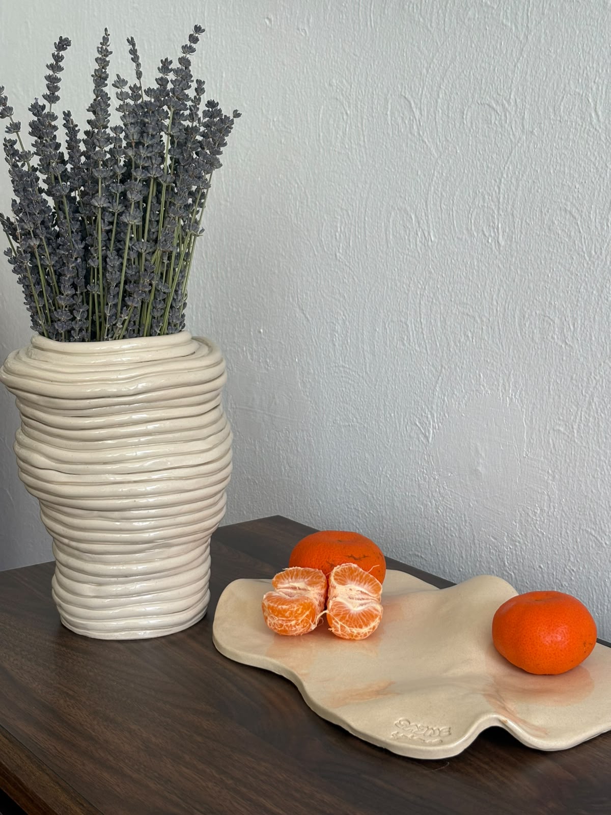Coil vase with lavender beside melting tray
